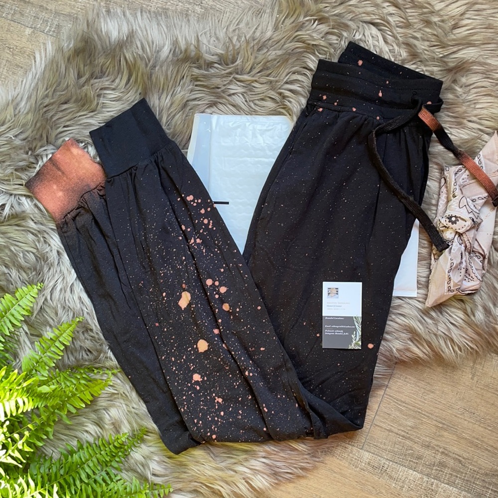 Woman’s distressed tie•dye, bleached out joggers